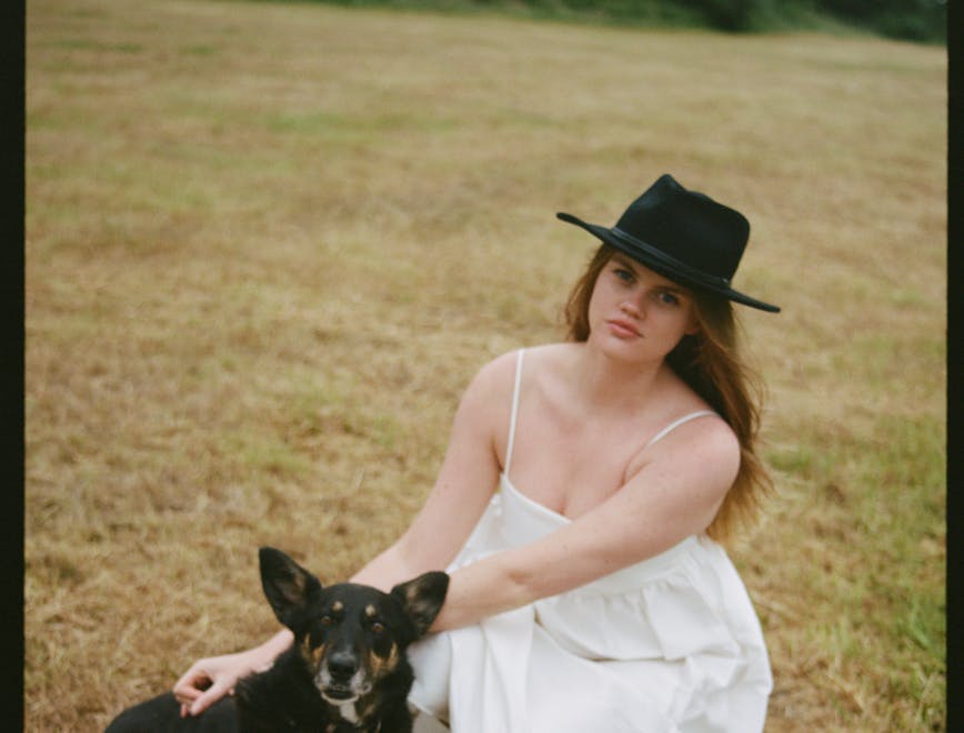 hat dress adult female person woman sun hat formal wear dog grass