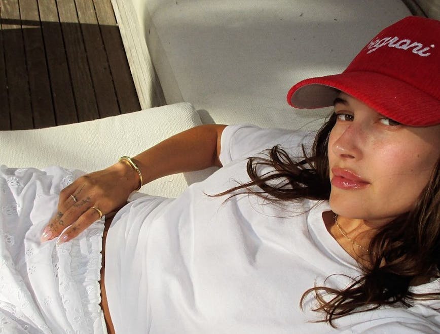 baseball cap cap hat person photography portrait blouse couch accessories bracelet